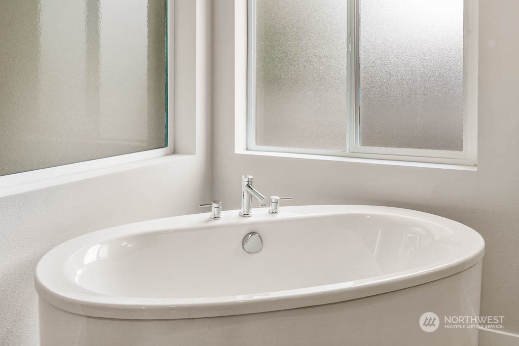 22921 20th Place West Bothell, WA 98021 - Photo 19 of 27 a white bath tub sitting next to a white sink
