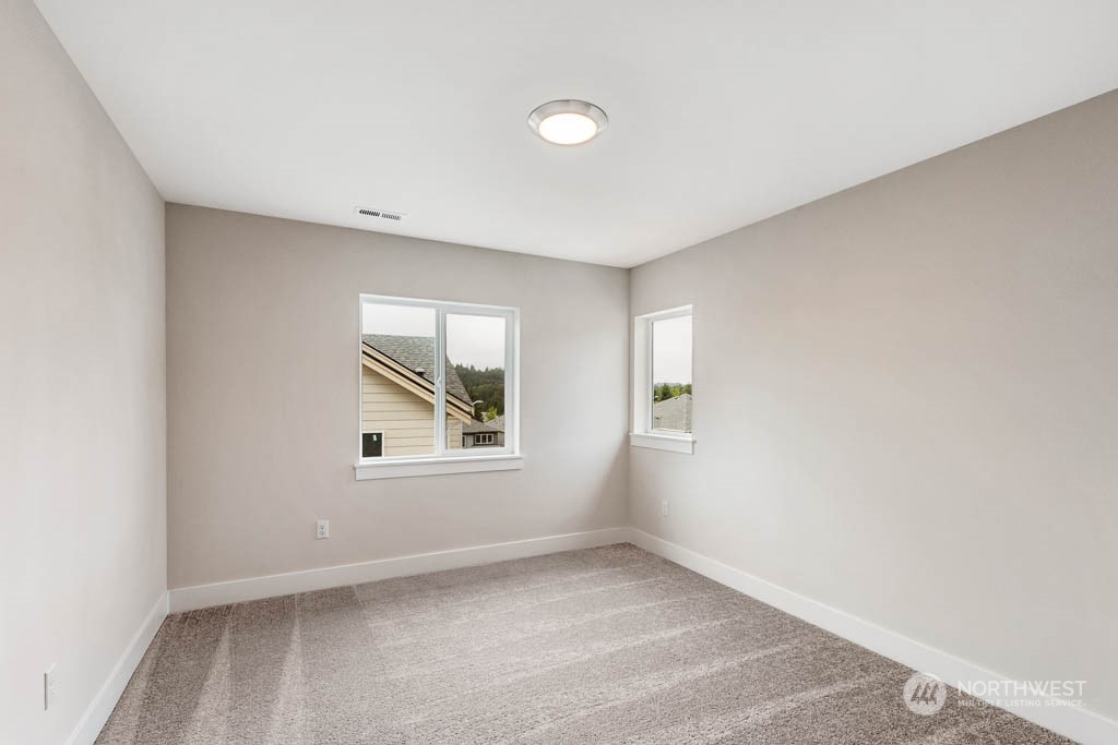 22921 20th Place West Bothell, WA 98021 - Photo 20 of 27 an empty room with windows