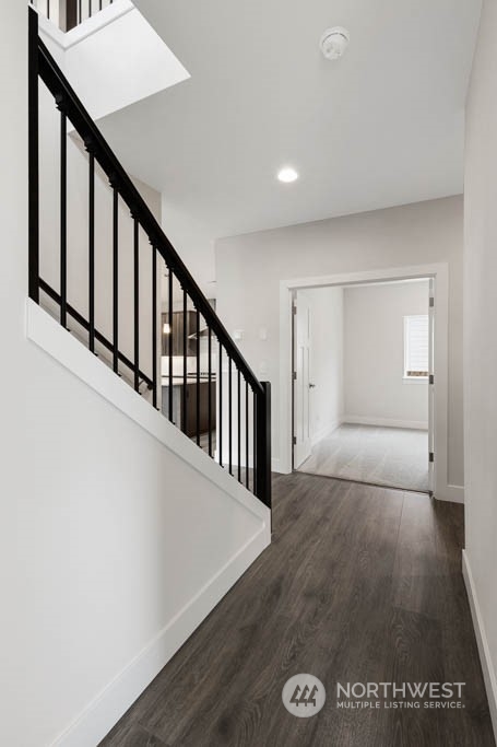 22921 20th Place West Bothell, WA 98021 - Photo 2 of 27 a view of staircase with wooden floor and white walls