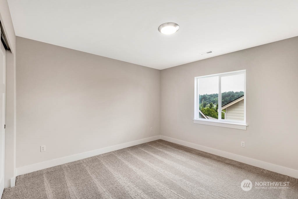 22921 20th Place West Bothell, WA 98021 - Photo 21 of 27 an empty room with a window