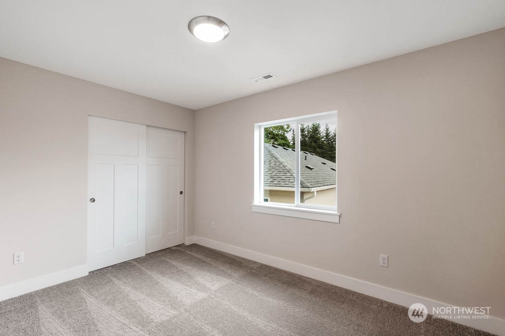 22921 20th Place West Bothell, WA 98021 - Photo 23 of 27 an empty room with windows