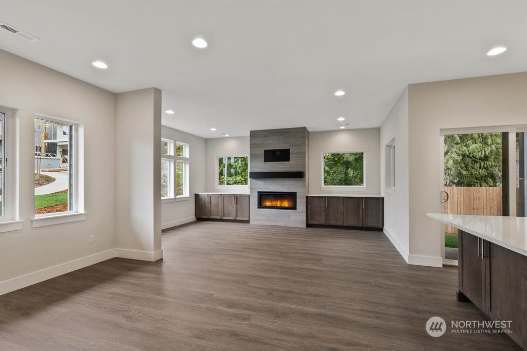 22921 20th Place West Bothell, WA 98021 - Photo 3 of 27 a view of an empty room with a window and wooden floor
