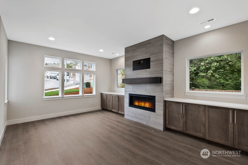22921 20th Place West Bothell, WA 98021 - Photo 8 of 27 a view of empty room with a fireplace and window