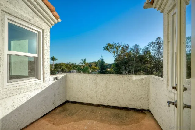 a large bathroom with a large mirror vanity and a sink