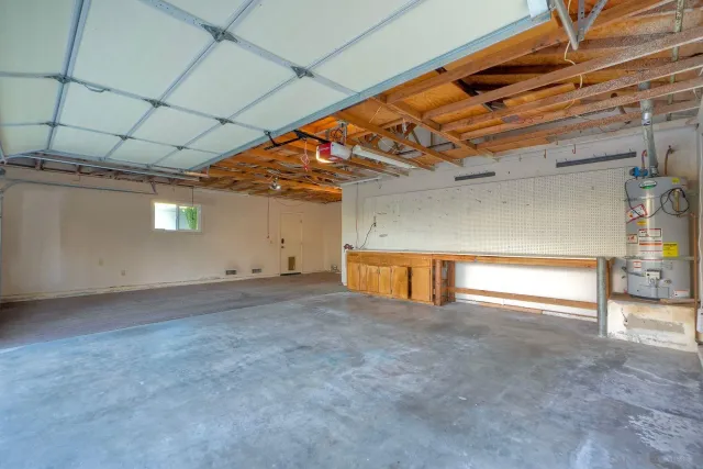 view of a house with a yard and sitting area