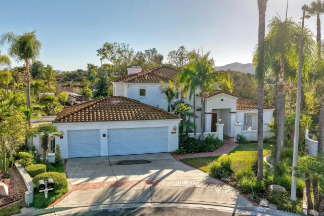 an aerial view of multiple house with yard