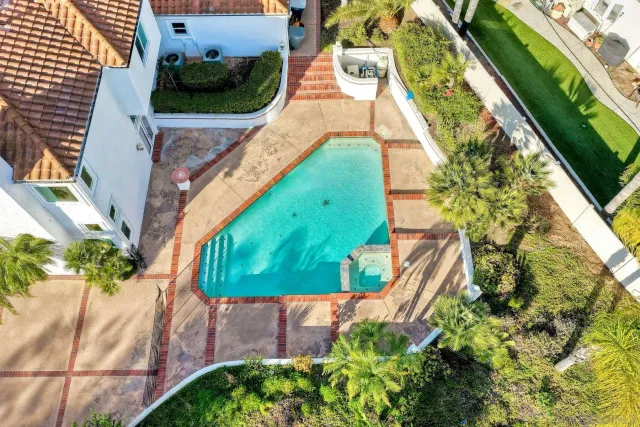 a view of a lush green hillside and a houses