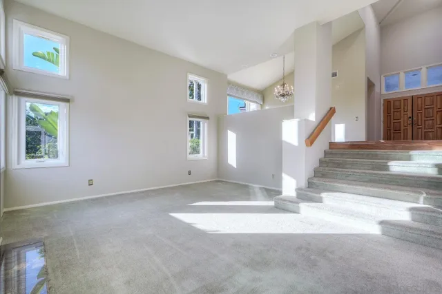 a view of entryway and hall with a window