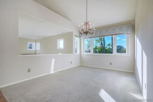 a bathroom with a toilet a sink and a window