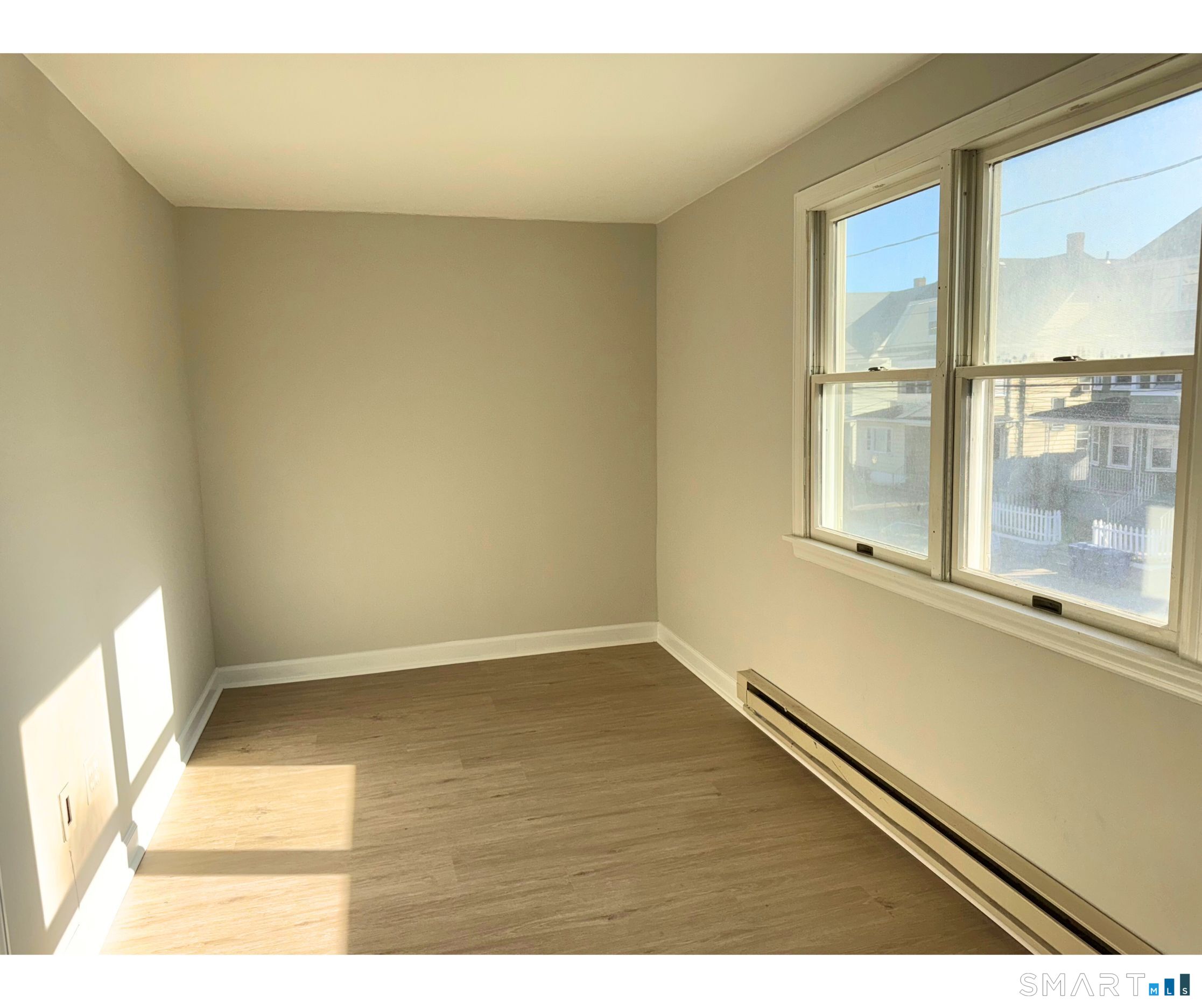 74 Garfield Avenue Bridgeport, CT 06606 - Photo 9 of 14 a view of an empty room and a window