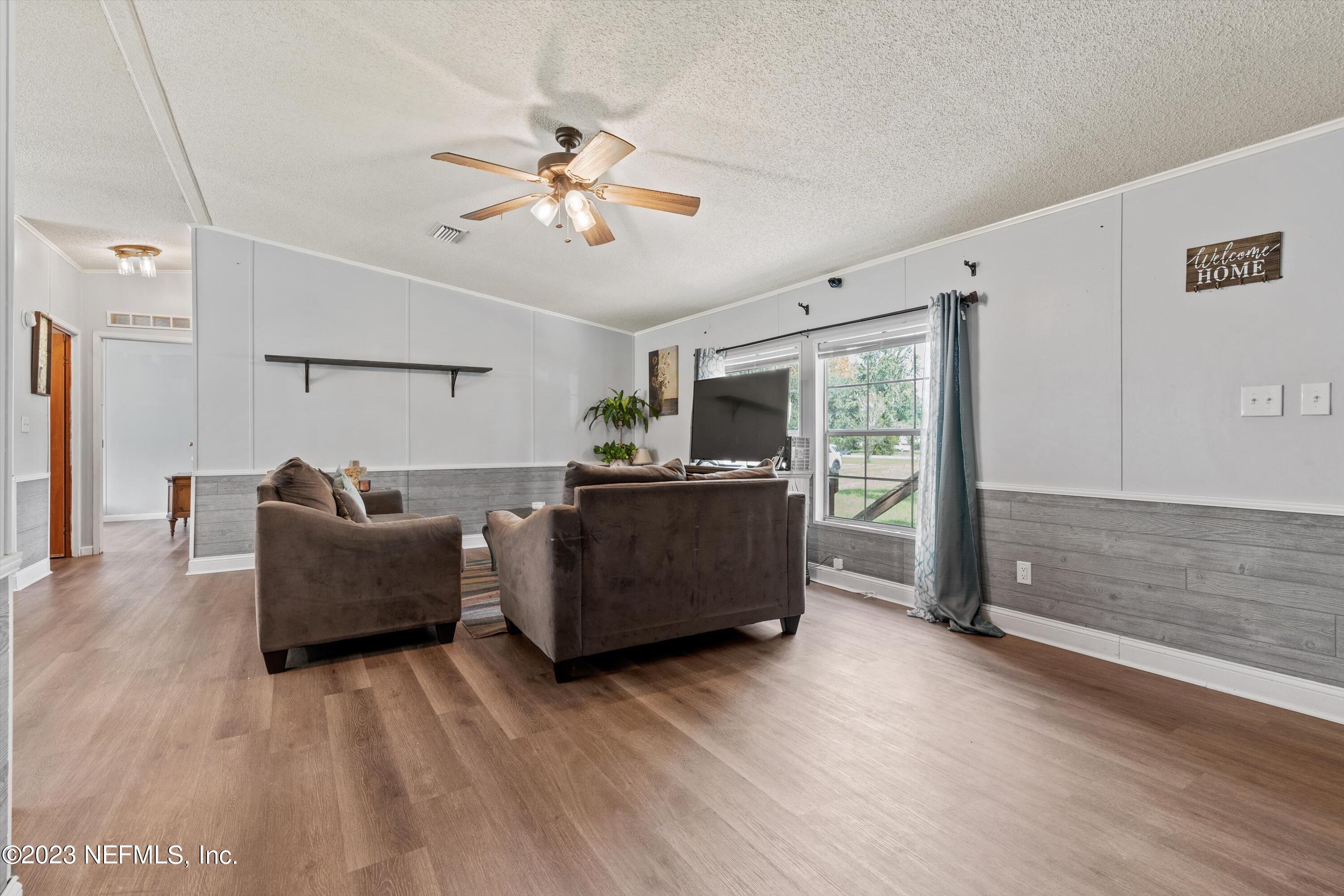 7940 Plummer Road Jacksonville, FL 32219 - Photo 6 of 27 06-Living Room