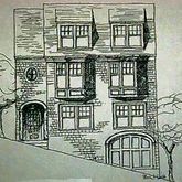 a front view of a building with a street