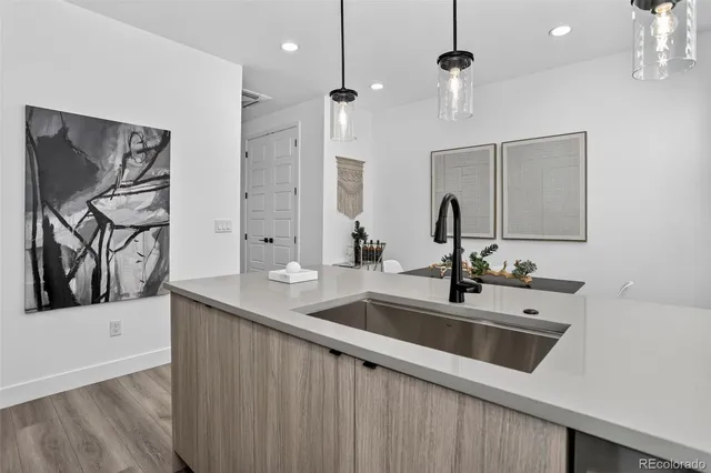 a large bedroom with bed and wooden floor