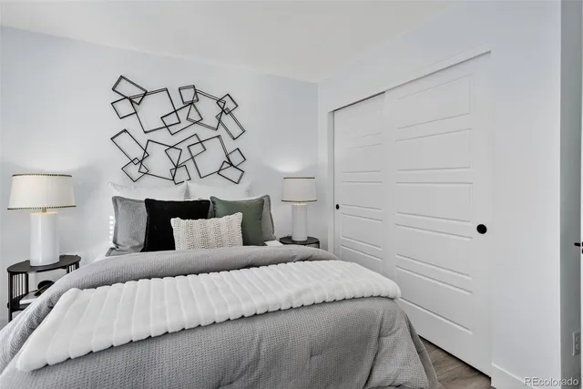 a bedroom with a bed and a couch