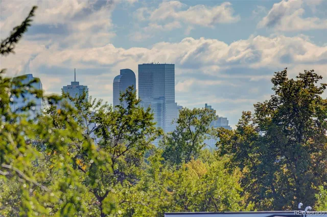 a view of a street with buildings in the background