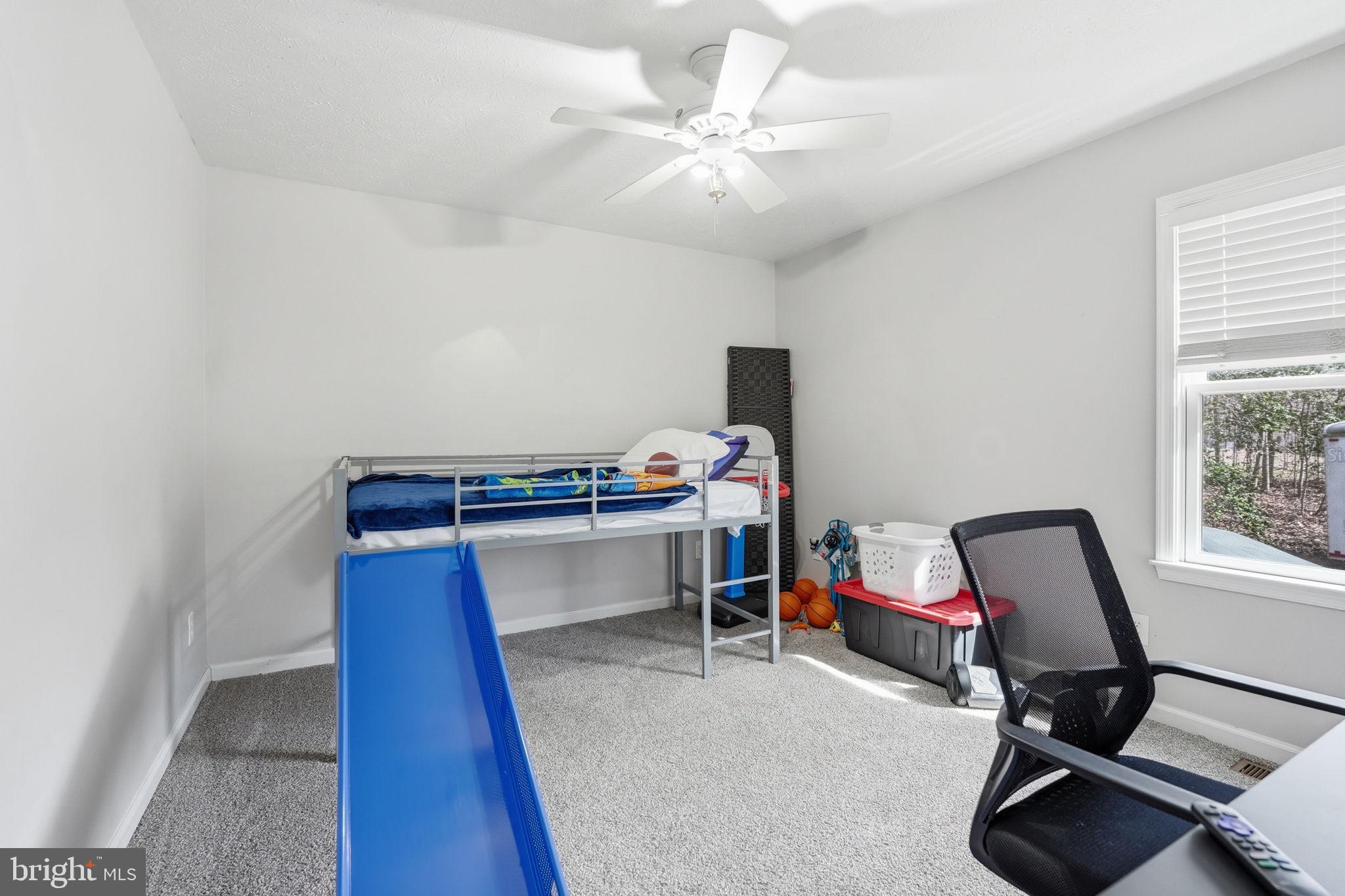 9334 Inaugural Drive King George, VA 22485 - Photo 12 of 26 a view of a workspace with furniture and a window