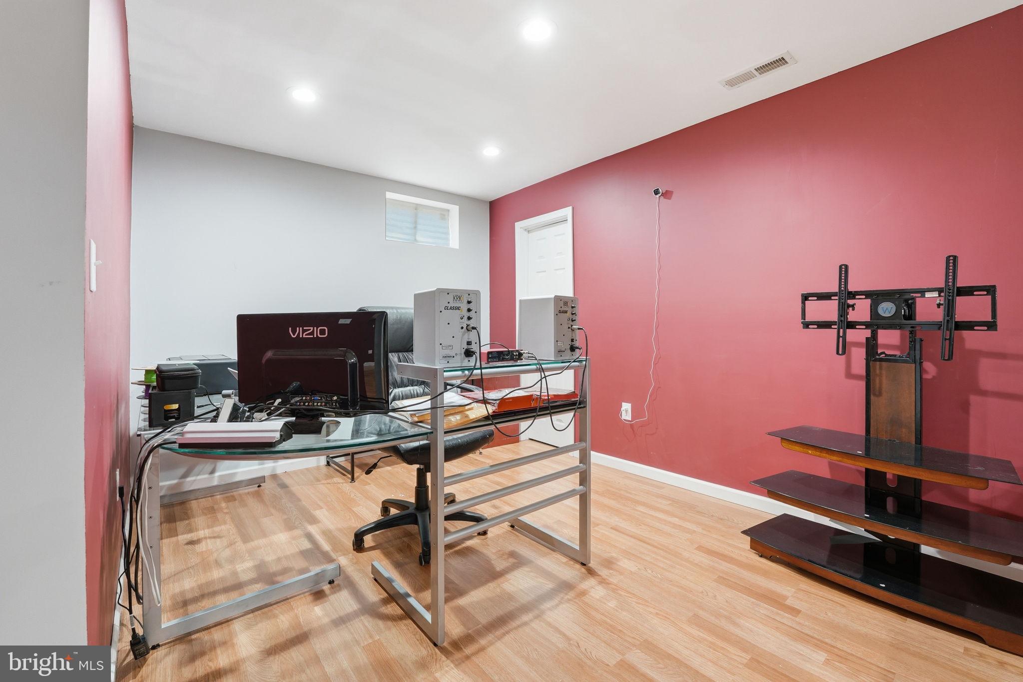 9334 Inaugural Drive King George, VA 22485 - Photo 18 of 26 a room with gym equipment and a wooden floor
