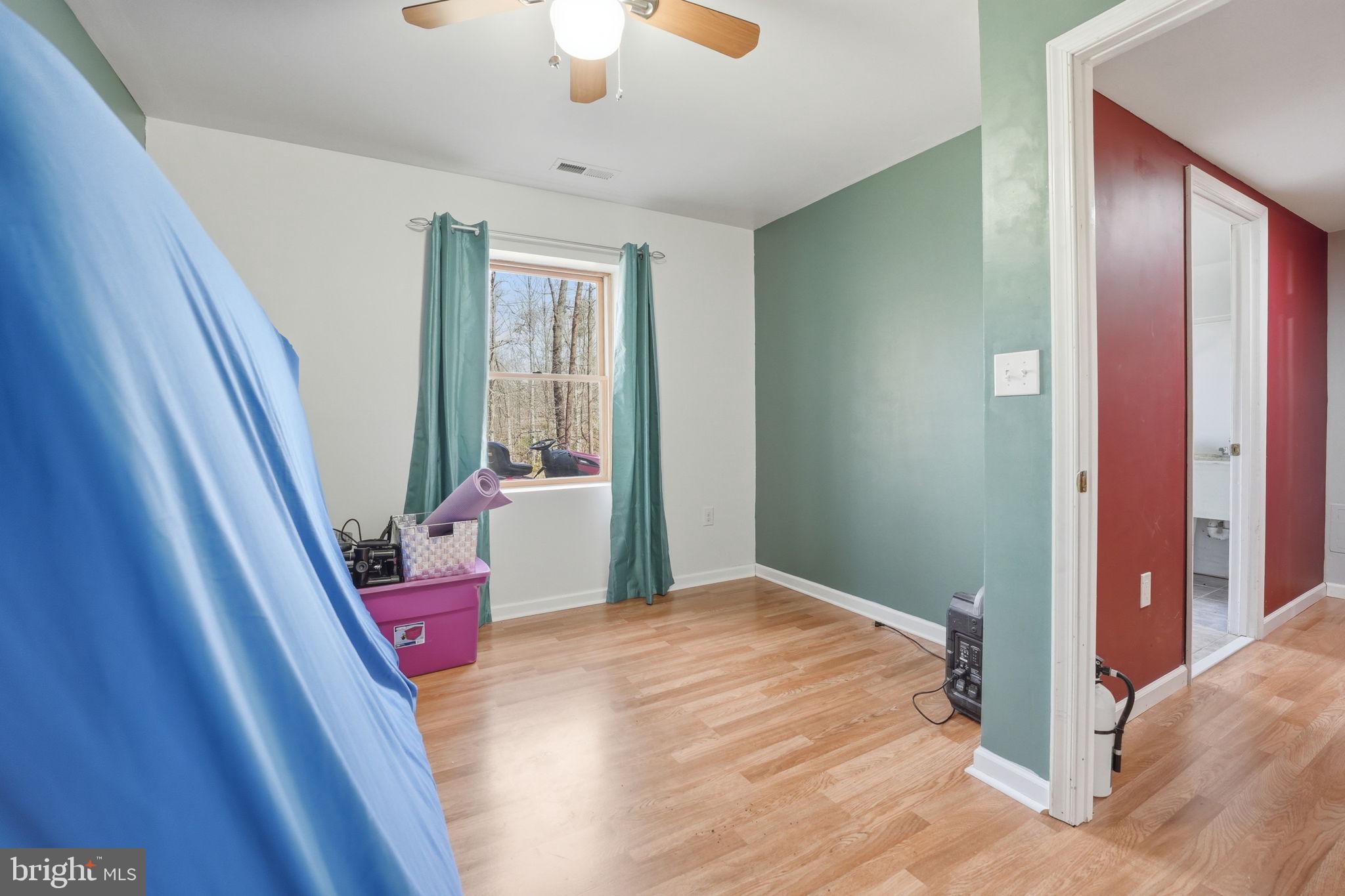 9334 Inaugural Drive King George, VA 22485 - Photo 20 of 26 a bedroom with a bed and a large window