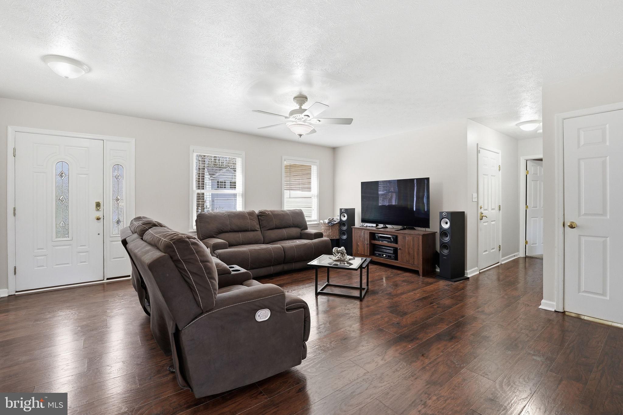 9334 Inaugural Drive King George, VA 22485 - Photo 3 of 26 a living room with furniture and a flat screen tv