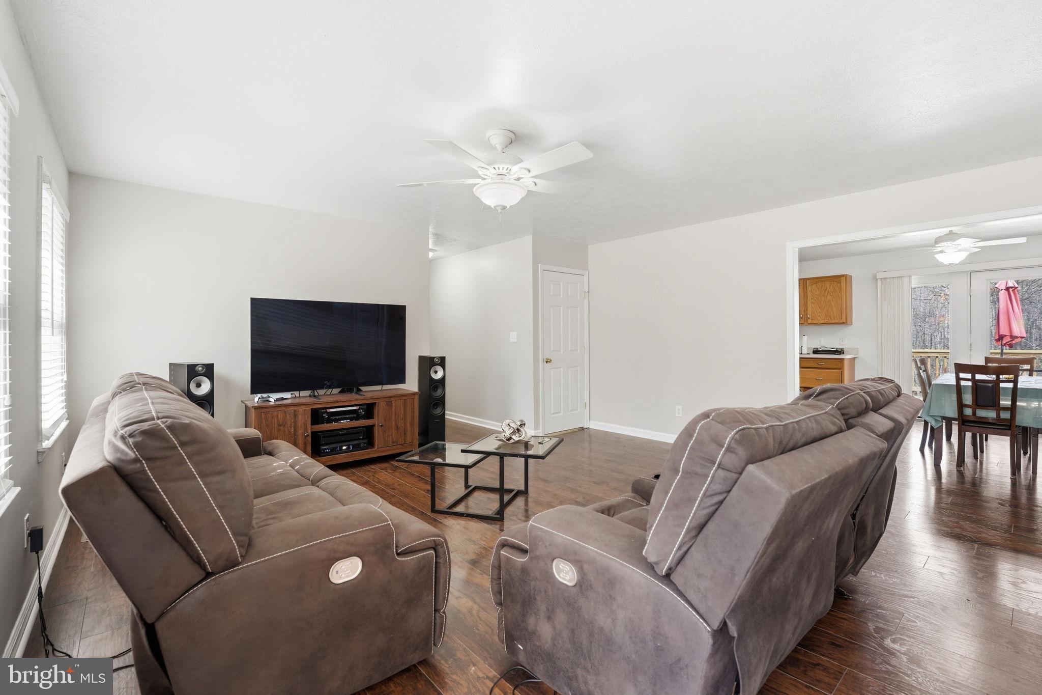 9334 Inaugural Drive King George, VA 22485 - Photo 4 of 26 a living room with furniture and a flat screen tv