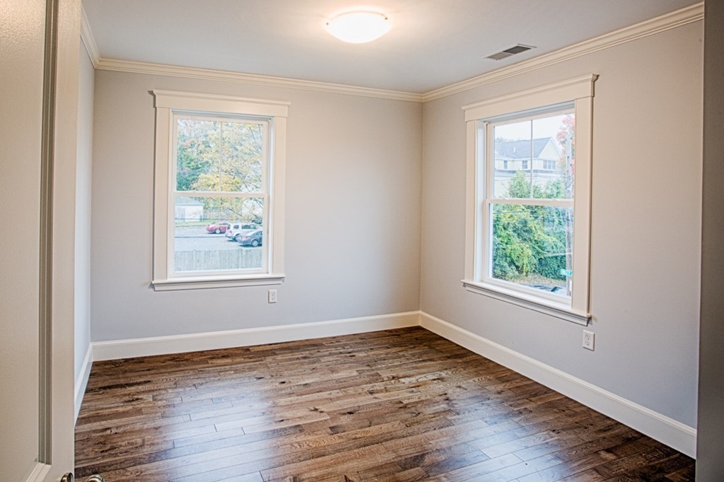 29 Lafayette Road Ipswich, MA 01938 - Photo 15 of 20 a view of an empty room with wooden floor and a window