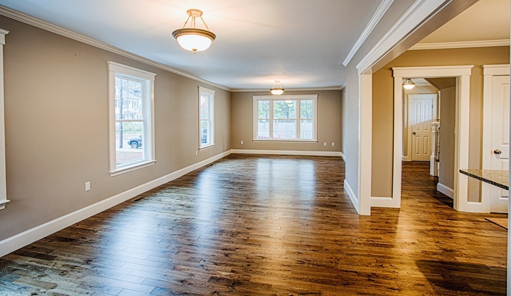 29 Lafayette Road Ipswich, MA 01938 - Photo 4 of 20 a view of an empty room with wooden floor and a window