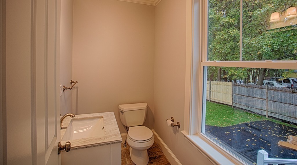 29 Lafayette Road Ipswich, MA 01938 - Photo 9 of 20 a white toilet sitting next to a small yard