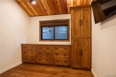 a view of front door with wooden floor