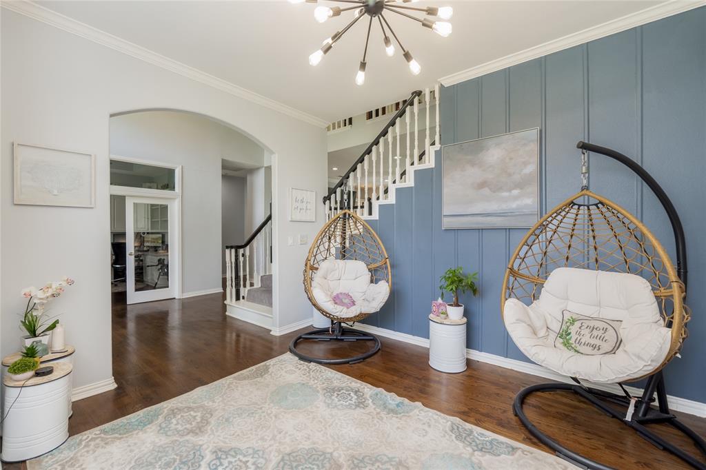 135 Kirkpatrick Road Ennis, TX 75119 - Photo 6 of 40 a view of a hallway with dining room and wooden floor