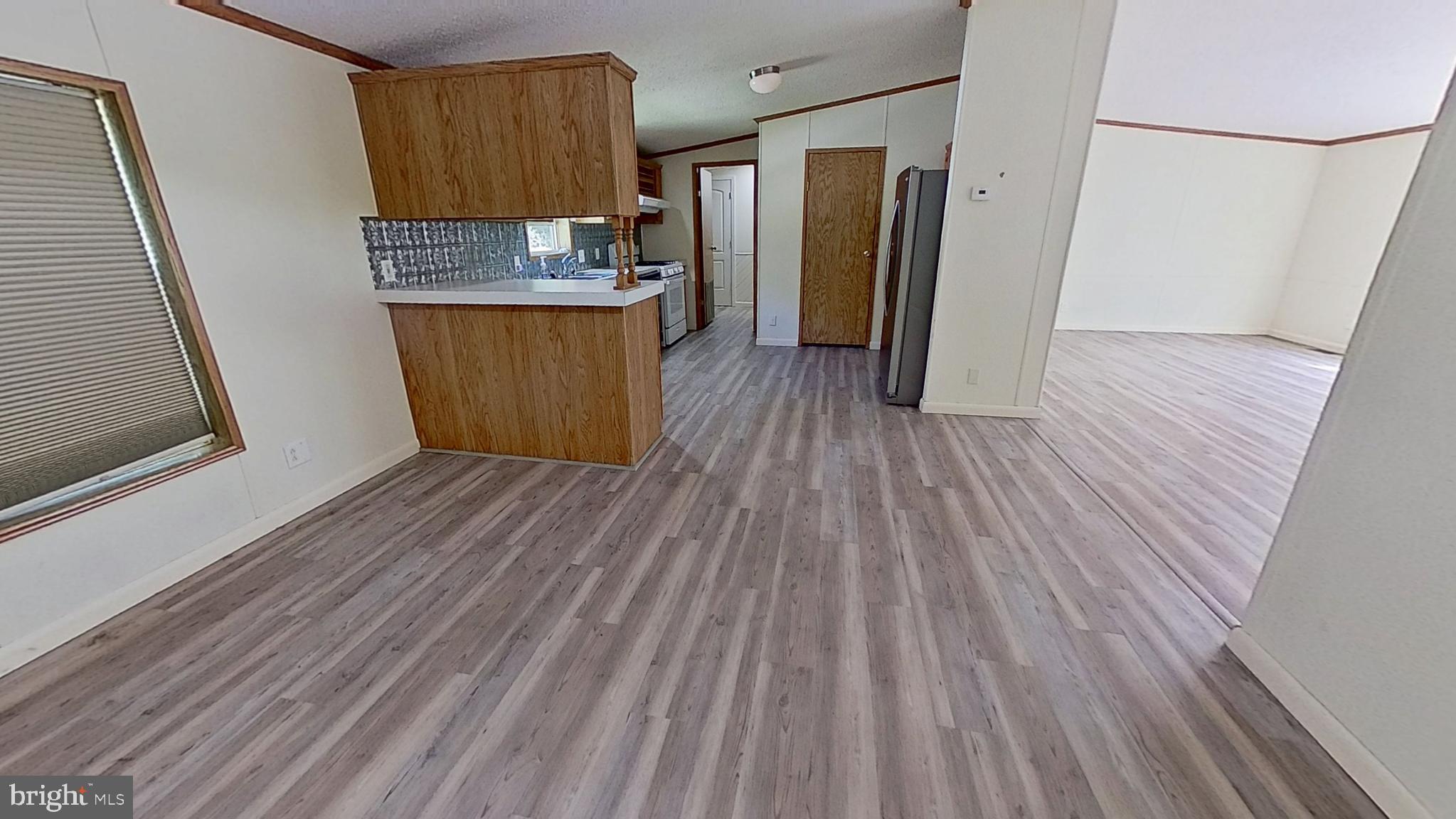 4975 Spring Road Hellam, PA 17406 - Photo 5 of 13 a view of a kitchen with wooden floor and a sink