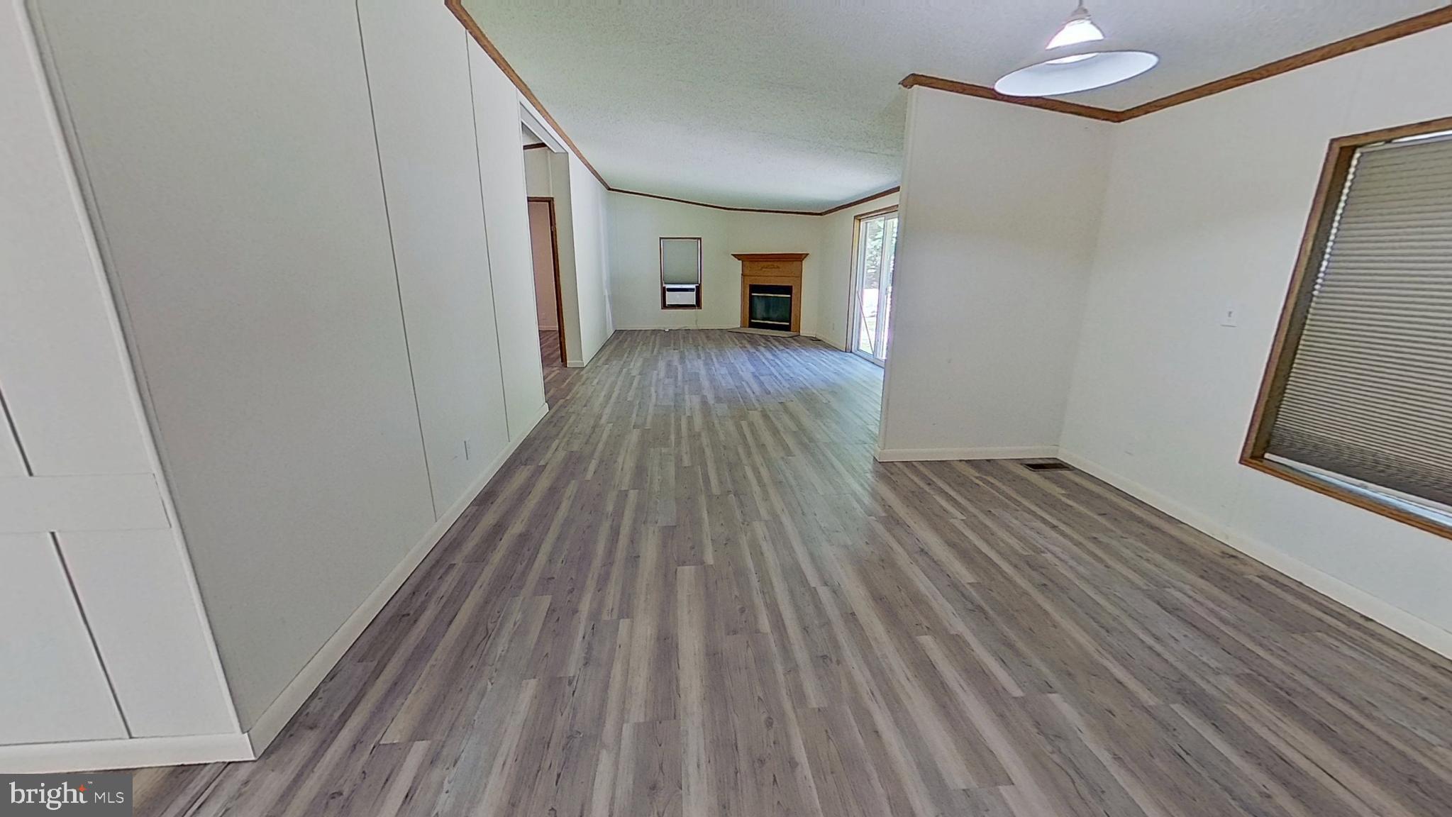 4975 Spring Road Hellam, PA 17406 - Photo 6 of 13 a view of a hallway view with wooden floor