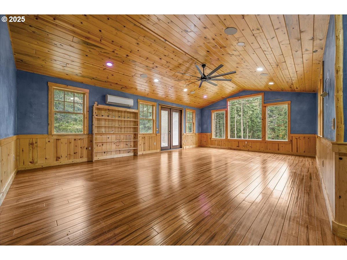 39577 Southeast Kitzmiller Road Eagle Creek, OR 97022 - Photo 17 of 41 a view of an empty room with wooden floor and a window