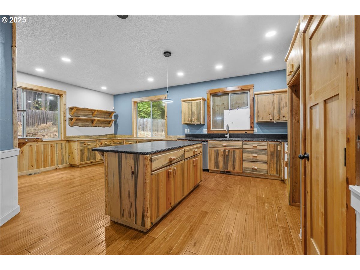 39577 Southeast Kitzmiller Road Eagle Creek, OR 97022 - Photo 3 of 41 a large kitchen with stainless steel appliances lots of counter top space