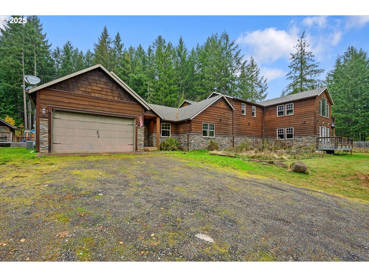 39577 Southeast Kitzmiller Road Eagle Creek, OR 97022 - Photo 37 of 41 a house with green field in front of it