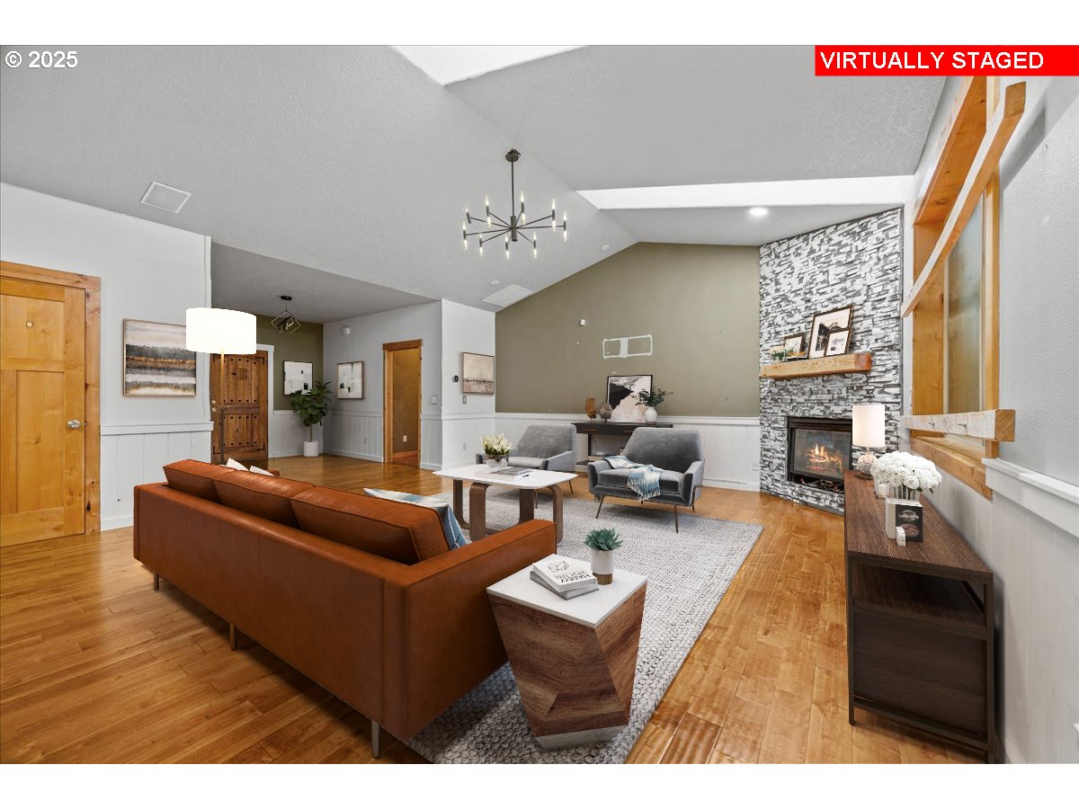39577 Southeast Kitzmiller Road Eagle Creek, OR 97022 - Photo 39 of 41 a living room with furniture a fireplace and a flat screen tv