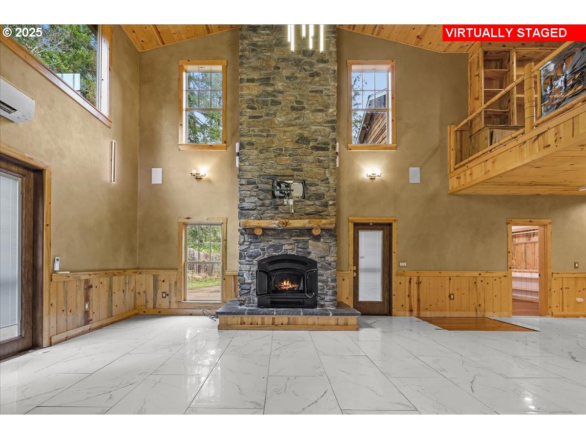39577 Southeast Kitzmiller Road Eagle Creek, OR 97022 - Photo 9 of 41 a view of a livingroom with fireplace and cabinet