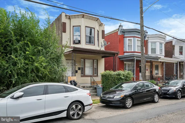a view of a car parked in front of a building