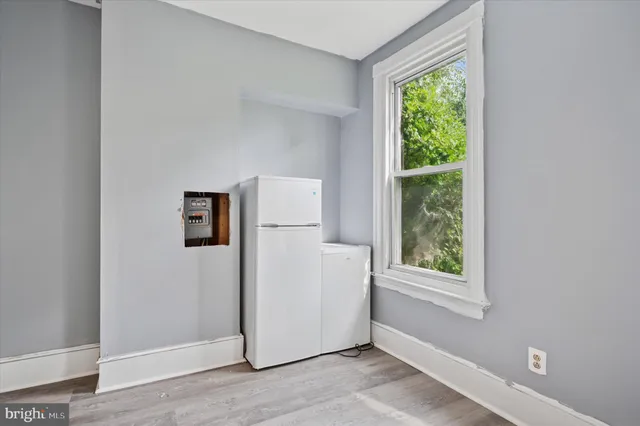 a view of a storage & utility room with a window