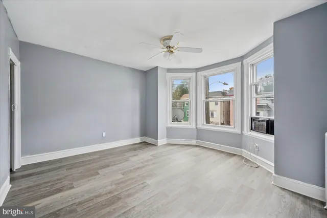 a view of an empty room with a window