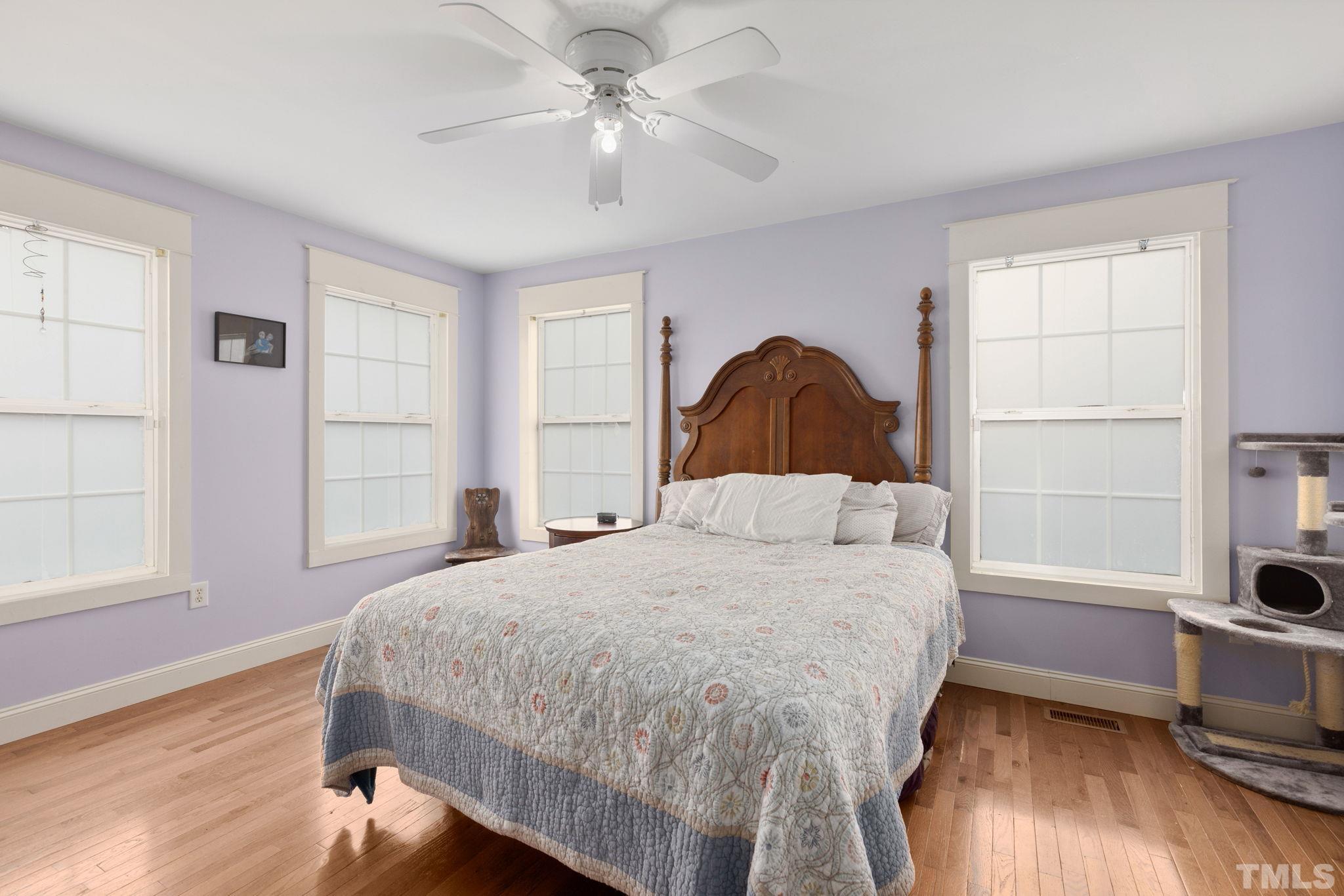 330 Pershing Road Raleigh, NC 27608 - Photo 19 of 51 a bedroom with a bed and a window