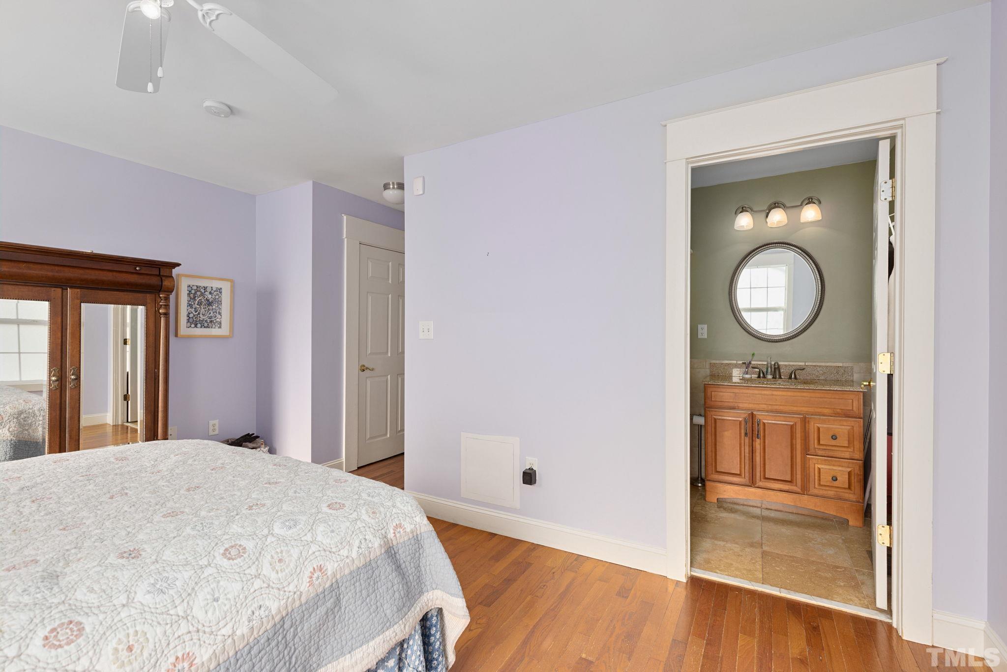 330 Pershing Road Raleigh, NC 27608 - Photo 20 of 51 a bedroom with a bed and a dresser