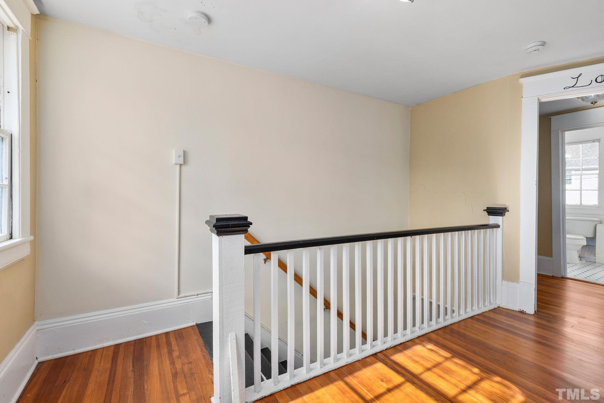 330 Pershing Road Raleigh, NC 27608 - Photo 23 of 51 a view of hallway with wooden floor