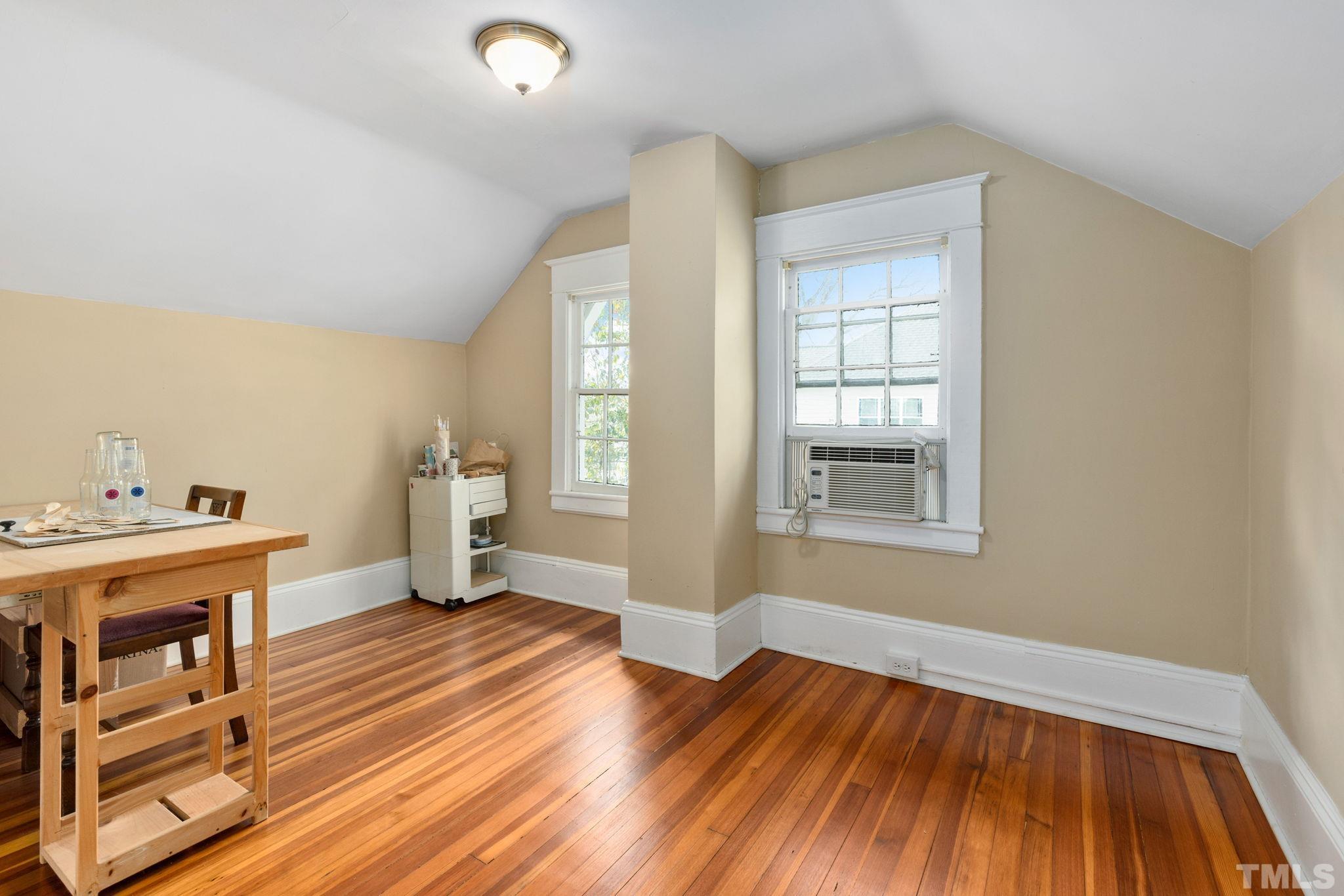 330 Pershing Road Raleigh, NC 27608 - Photo 25 of 51 Bedroom 2 is currently being used as an art studio. Buyers will appreciate the attic storage found in this room.