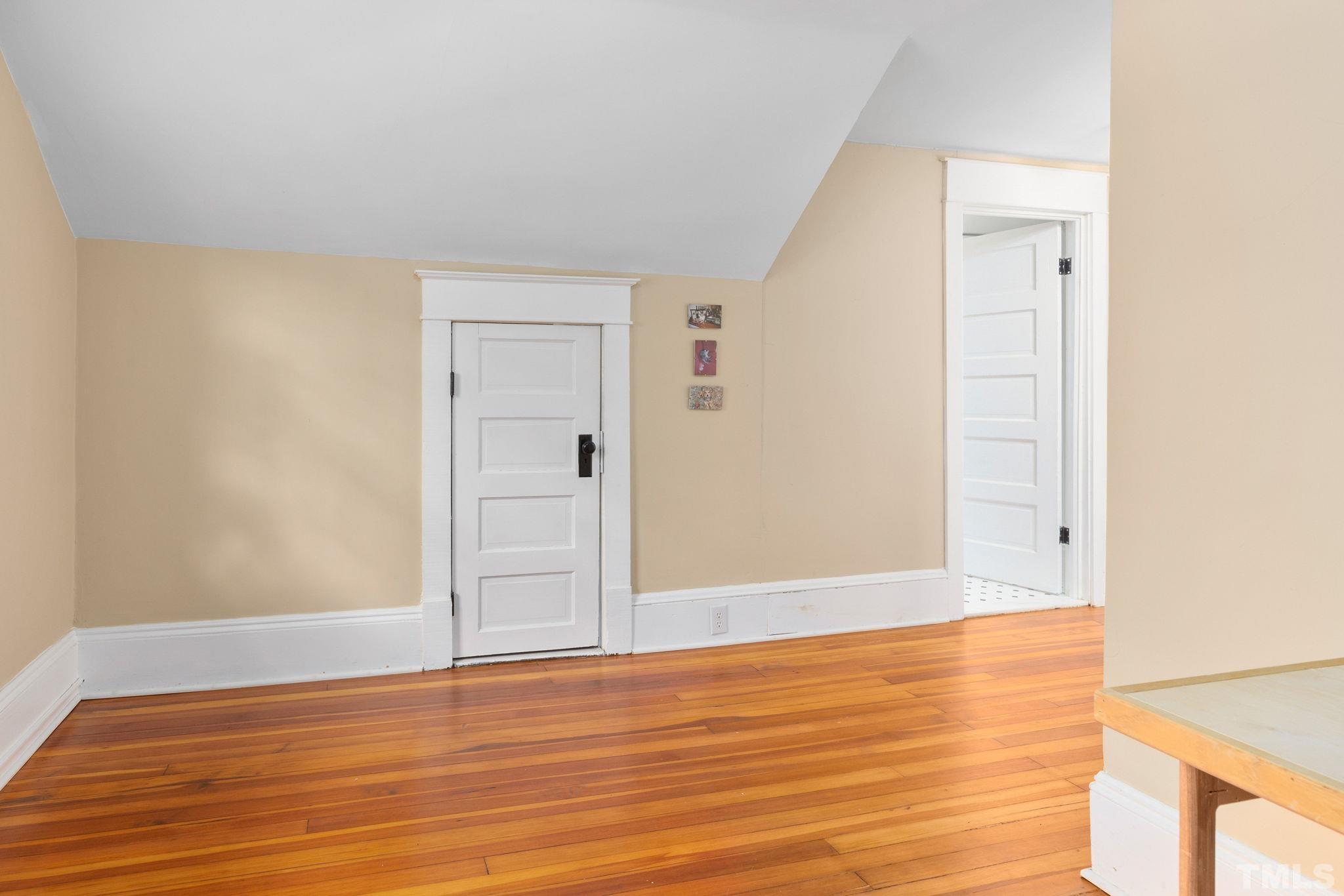 330 Pershing Road Raleigh, NC 27608 - Photo 26 of 51 a view of an empty room with wooden floor