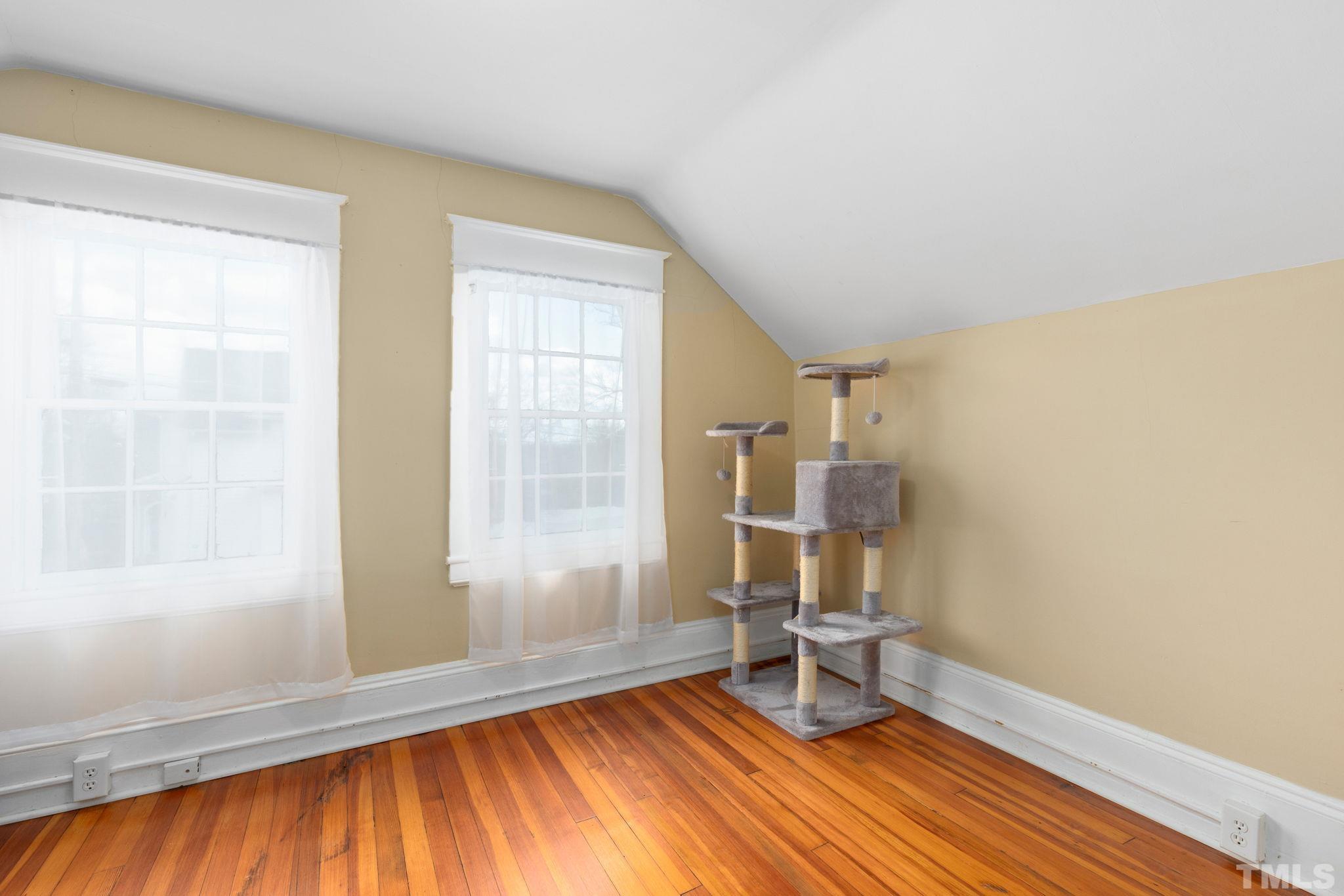 330 Pershing Road Raleigh, NC 27608 - Photo 29 of 51 a view of empty room with wooden floor and fan