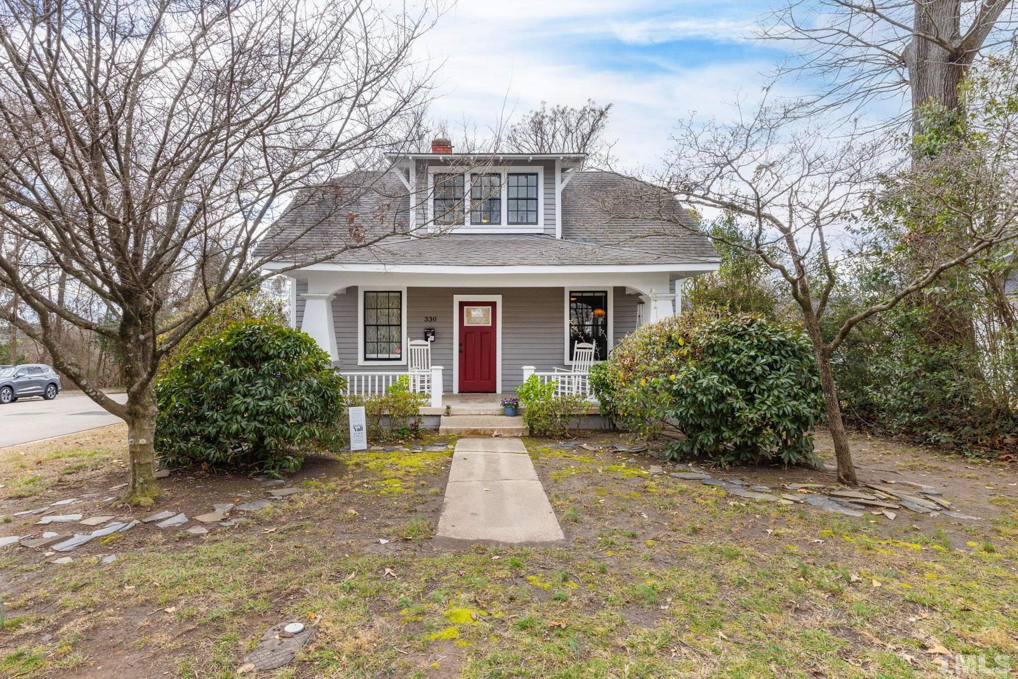 330 Pershing Road Raleigh, NC 27608 - Photo 3 of 51 a front view of house with yard and green space