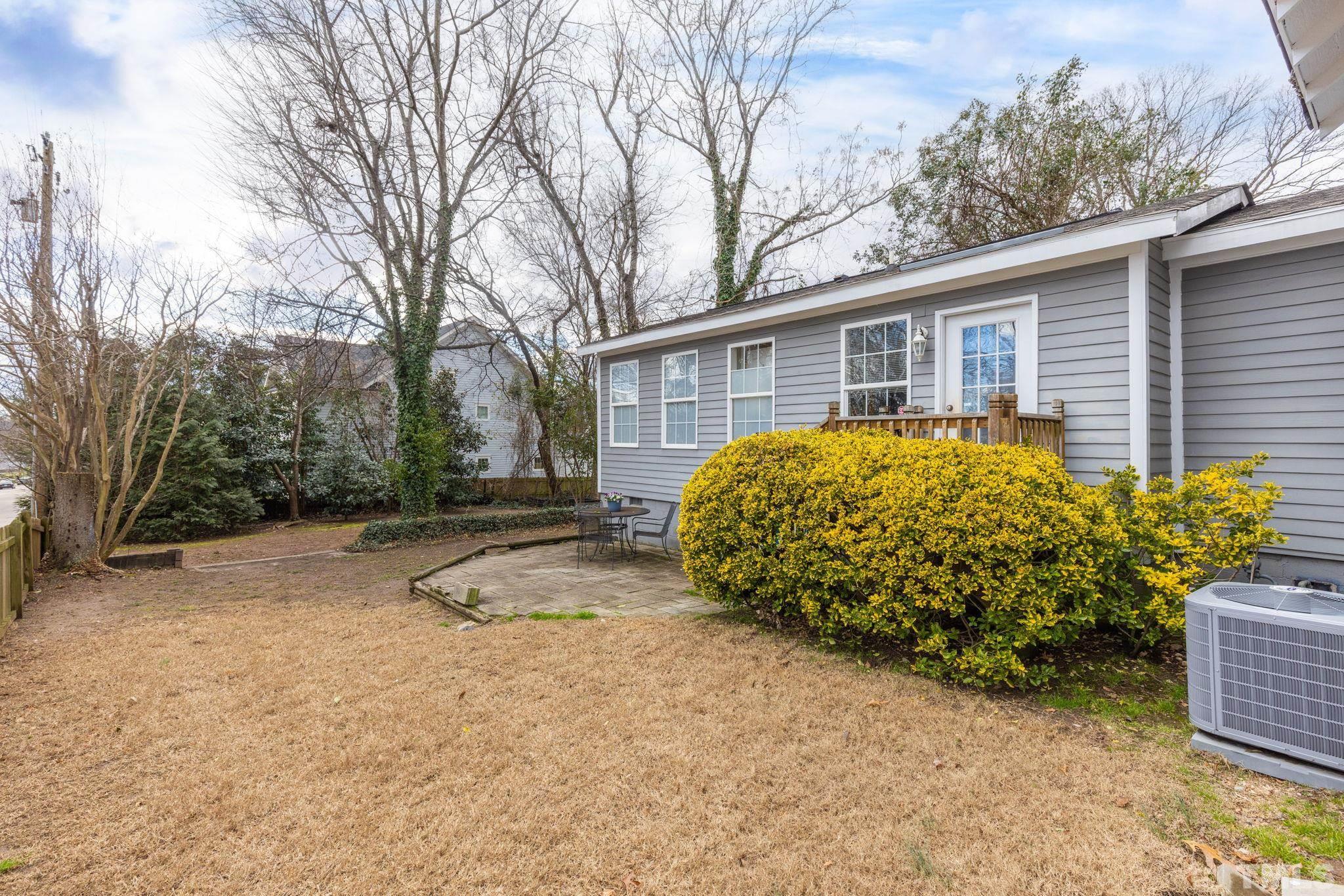 330 Pershing Road Raleigh, NC 27608 - Photo 32 of 51 a view of a house with a yard and potted plants