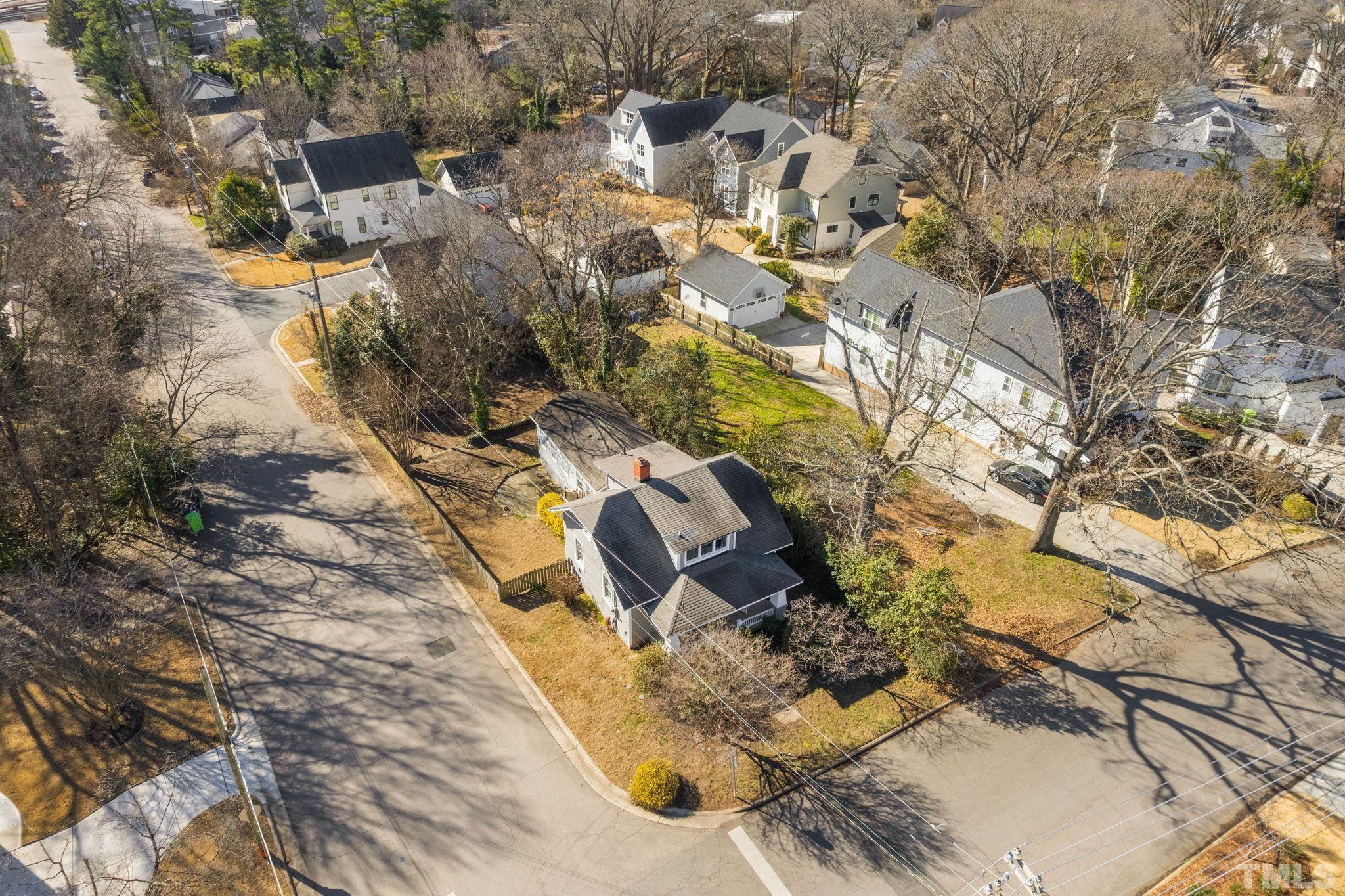 330 Pershing Road Raleigh, NC 27608 - Photo 42 of 51 an aerial view of a house with swimming pool and large trees