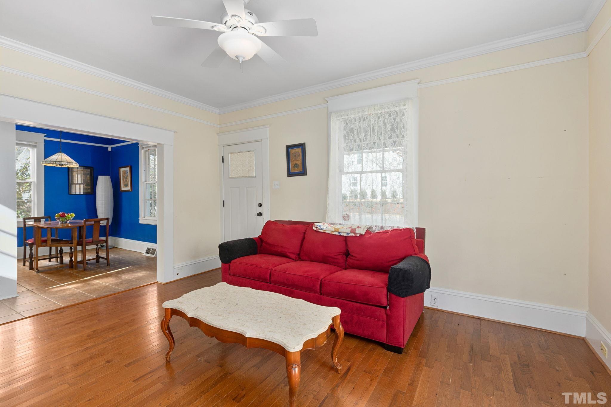 330 Pershing Road Raleigh, NC 27608 - Photo 5 of 51 a living room with furniture and wooden floor