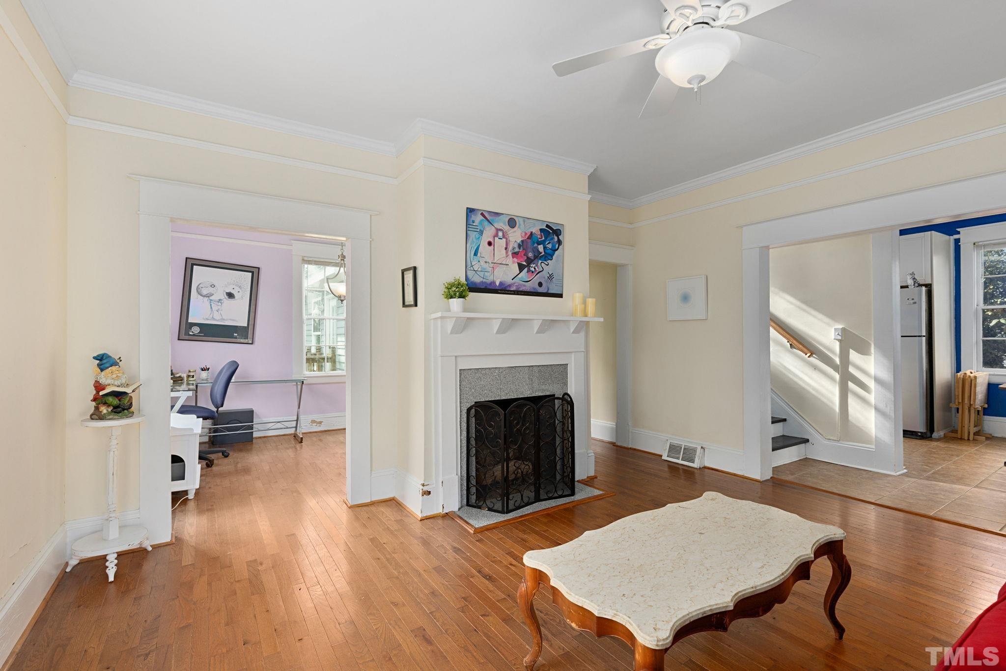 330 Pershing Road Raleigh, NC 27608 - Photo 7 of 51 a living room with furniture and a fireplace